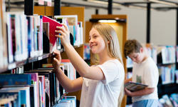 Teenage girl in library